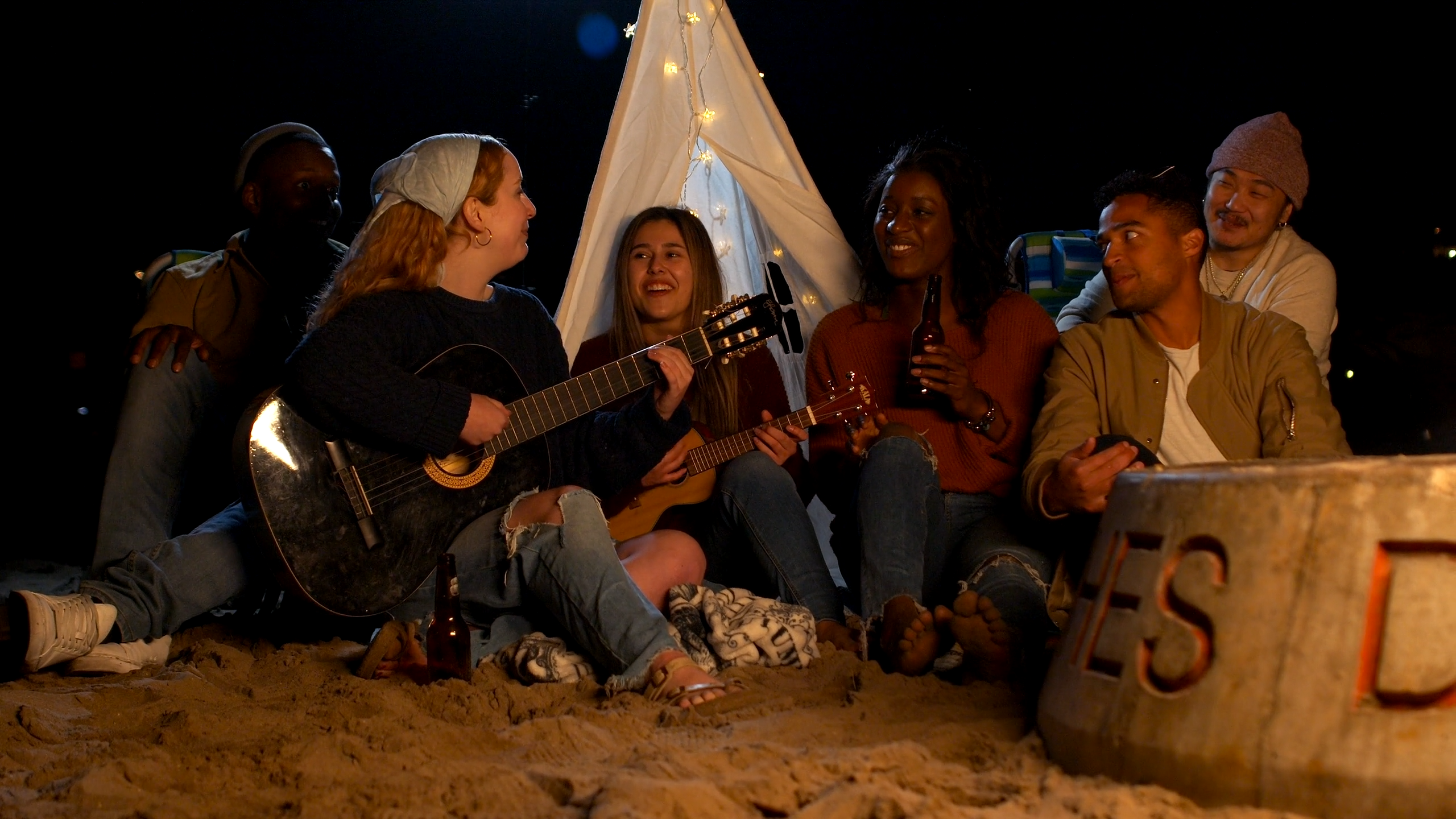 Friends Camping at Night